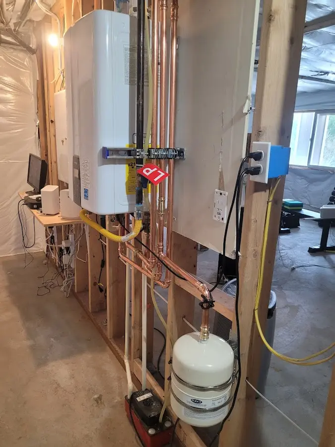 Licensed plumber repairing a kitchen sink in South Greeley
